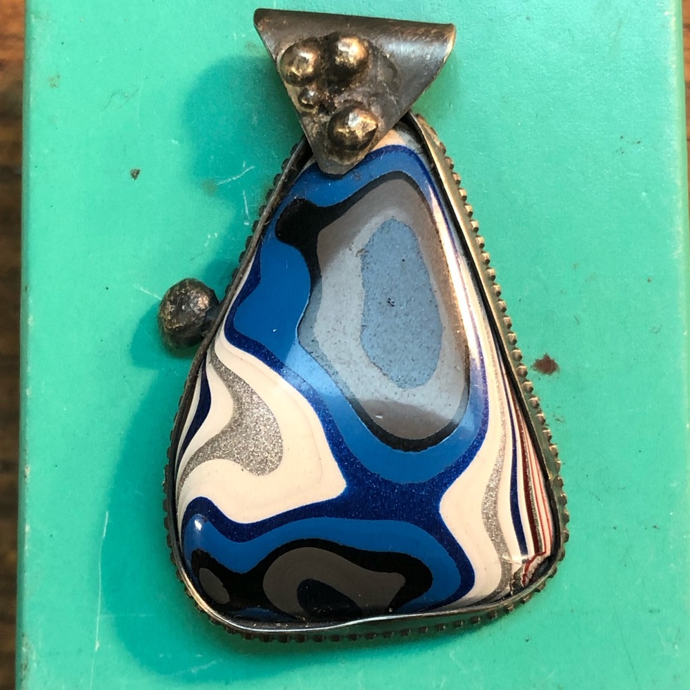 One of a kind fordite pendants